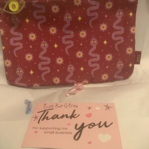 CUTE Burgundy Ipsy Cosmetic Bag with Snake and Evil Eye Designer pattern.